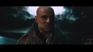 bald man in camouflage jacket in cave — Iron Man