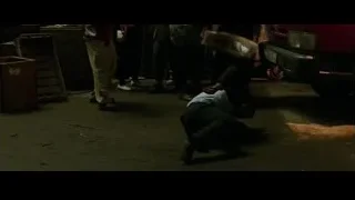 Man in suit crouching in dim room — Now You See Me 2