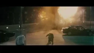 two men in parking lot with car on fire — Furious Seven