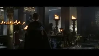 people in dimly lit room with fireplace — Gladiator