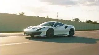 white sports car driving on a road — Sports Cars