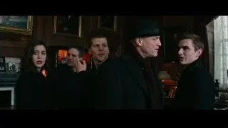 group with man in black hat by fireplace — Now You See Me 2