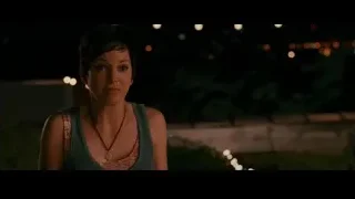 young woman in garden with string lights — The Dictator