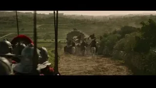People on horseback by stone archway — Gladiator 2