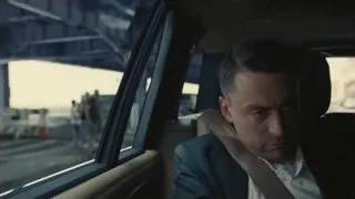 Man in suit sitting in car — Succession