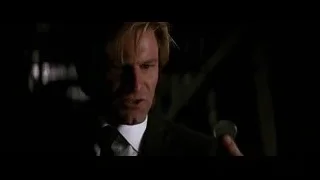 man in suit holding microphone — Batman: The Dark Knight