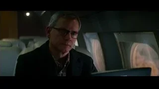 Man sitting in airplane looking at laptop — The Amazing Spider Man 2