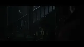 man standing on dark staircase — Doctor Strange 2