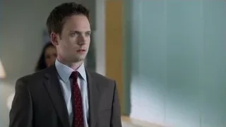 man in suit walking in hallway — Suits