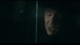 man's face in dark room wearing hat — Peaky Blinders