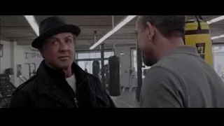 Two men in gym with boxing equipment — Creed