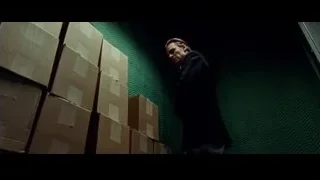 Man in suit in front of cardboard boxes — Steve Jobs
