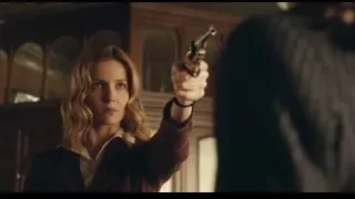 young woman holding gun pointing camera — Peaky Blinders