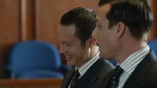 two men in suits in courtroom — Suits