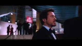 Two men in tuxedos in futuristic room — Iron Man