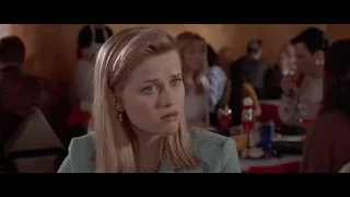 woman sitting at restaurant table — American Psycho