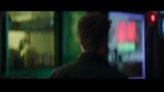 man looking at screen in dimly lit room — The Amazing Spider Man 2