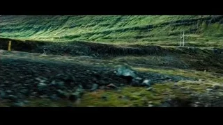 person in red jacket walking on mountain path — The Secret Life of Walter Mitty