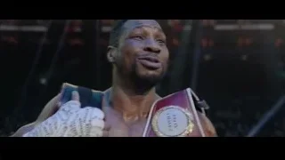 man in boxing ring with championship belt — Creed 3