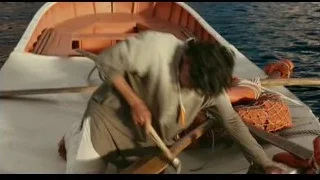 man working on boat in ocean — Life of Pi