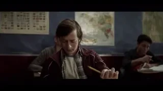 young man deep in thought in classroom — The Social Dilemma