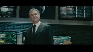 Man in suit in control room with monitors — Furious Seven