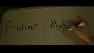 Hand writing on whiteboard — The Social Network