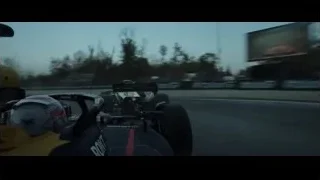 Red Bull racing car on track at dusk — F1