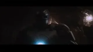 person's face in dark cave with flashlight — Iron Man