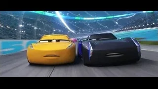 cars racing on track with stadium — Cars 3