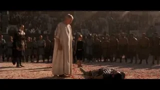 Man in white robe with crowd and rose petals — Gladiator