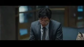 young man in suit sitting in office — The Big Short