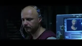 bald man with headphones at monitor — The Matrix