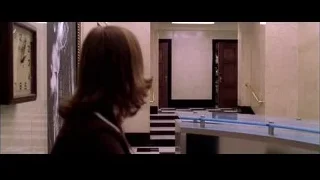 Woman walking in hallway with checkered floor — Spider Man 2