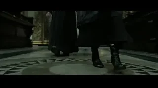 two people walking in dimly lit church — Harry Potter and the Deathly Hallows 2