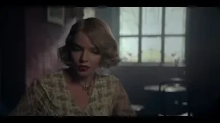 young woman in green dress in dim room — Peaky Blinders
