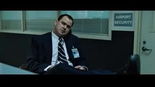 man in suit on phone in airport security — Fight Club
