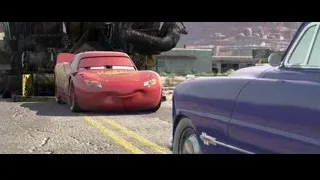 Lightning McQueen driving past crane — Cars