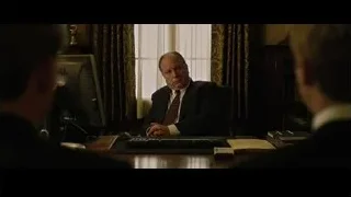 man in suit at office desk — The Social Network