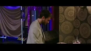 man in suit in dimly lit room — Now You See Me 2