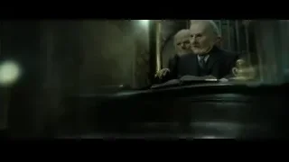 elderly man in suit sitting at desk — Harry Potter and the Deathly Hallows 2