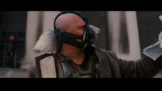 Masked man holding paper — Batman: The Dark Knight Rises