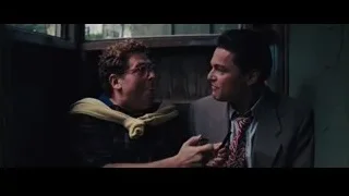 two men in dimly lit room smoking — The Wolf Of Wall Street