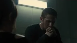 man and woman in dimly lit room praying — Blade Runner 2049
