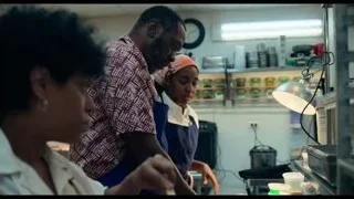 woman in blue apron in kitchen — The Bear