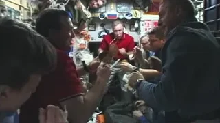 People gathered around man with scissors — Elon Musk: Return to Space