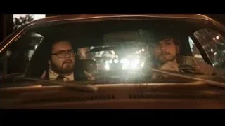 two men sitting in car at night — Jobs