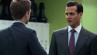 two men in suits conversing — Suits