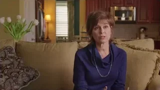 woman in blue sweater on couch — Screened Out