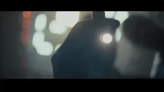 Gloved hand holding scalpel over patient — Creed 2